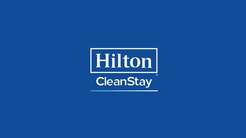 Aleph Doha Residences, Curio Collection By Hilton Exterior foto Hilton CleanStay logo