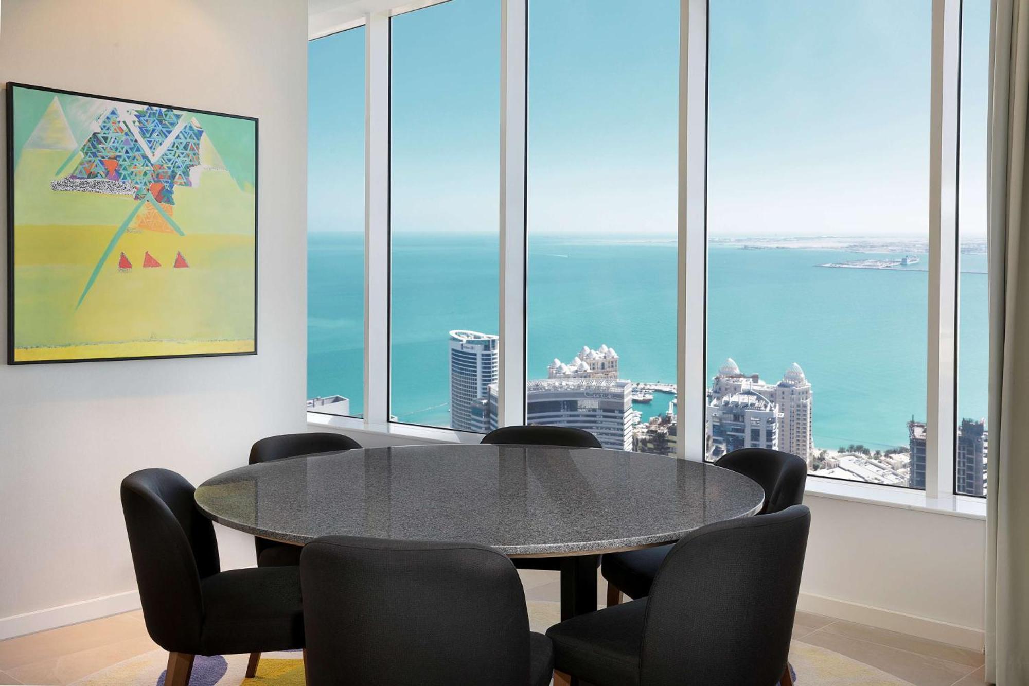 Aleph Doha Residences, Curio Collection By Hilton Exterior foto A dining room in a typical apartment